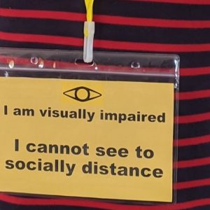Close up of visually impaired awareness badge