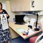 Linda from our Low Vision department performing a Low Vision test with one of our Members
