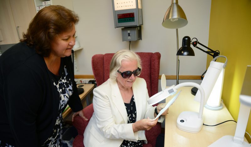 Lynda Thomas, Low Vision Coordinator at iSightCornwall performs a low vision assessment with one of our clients.