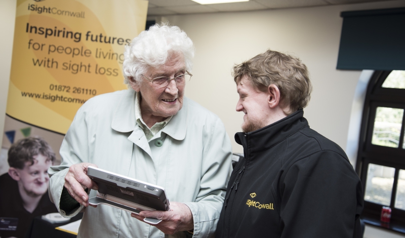 Our Customer Services Officer, Dom Hall demonstrates a Snow High Definition magnifier to an iSightCornwall client.