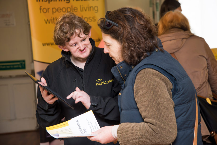 A member of the iSightCornwall team assists a member of the public at a recent event