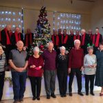 Photo shows Shirley (fourth from the right in a black jumper) with friends and supporters at the Saltash BAPS celebration in December 2019