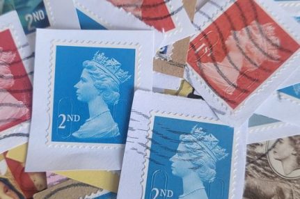a pile of stamps that have been cut off letters