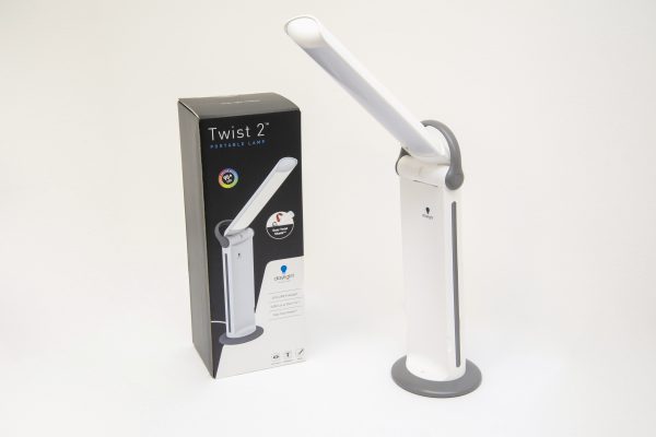 A white light with a base and a folding hinge stands next to a box which reads Twist 2