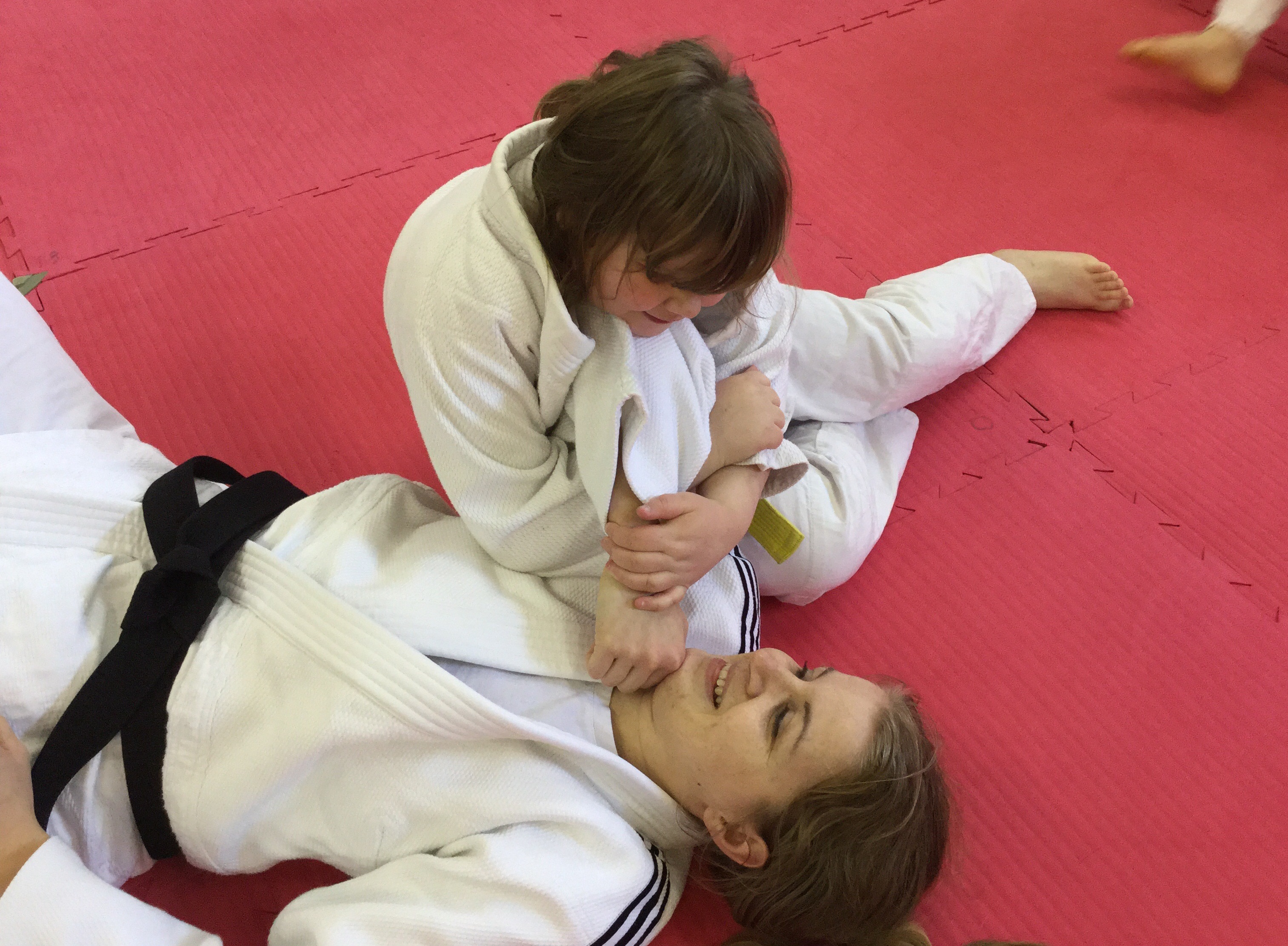 Two females taking part in visually impaired judo